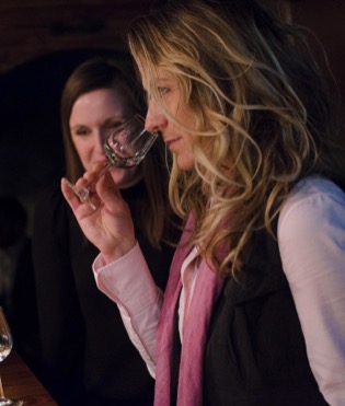 Image of a woman smelling a glass of vodka